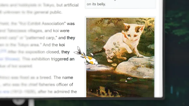 A koi swimming near a cat photo on the desktop